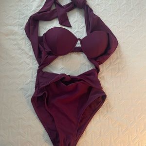 Andrea Iyamah purple swimsuit